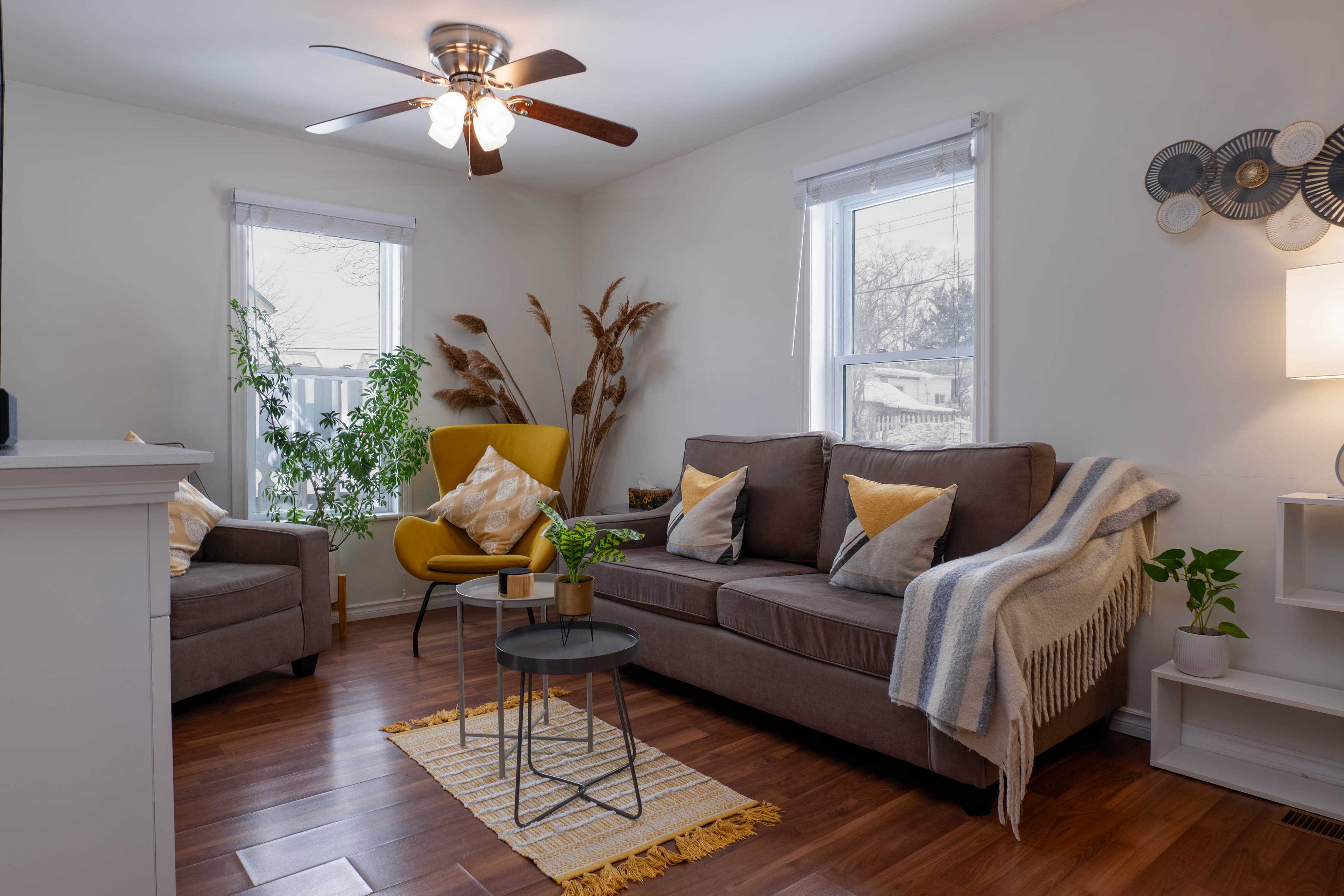 Bright modern living room with neutral palette and warm wood floors